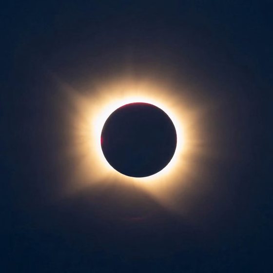Full totality with the corona streaming around the black disc of the moon