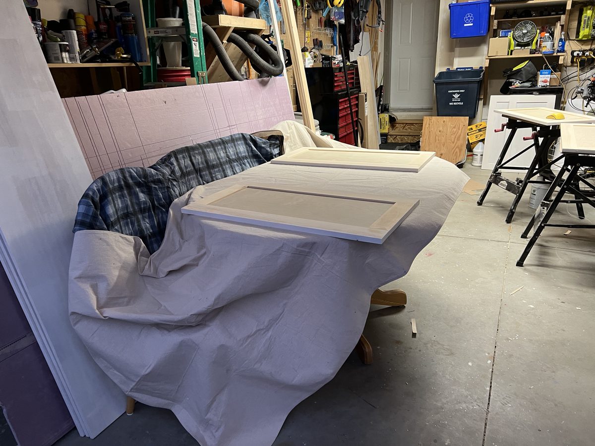 Painting cabinet pieces in the garage